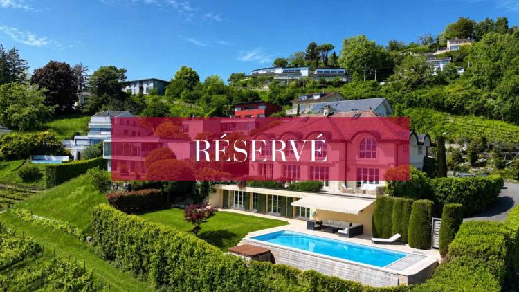 Esclusiva di Lutry: villa di 420 m2 con vista panoramica sul lago.